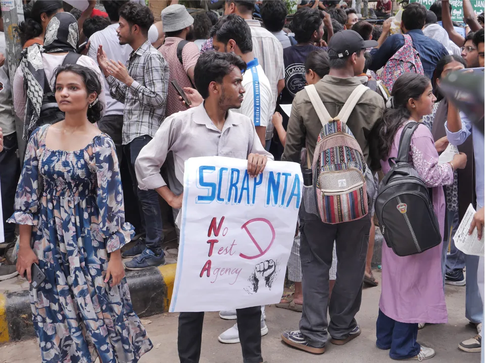 Protesters holding Scrap NTA posters during a demonstration against National Testing Agency exam issues