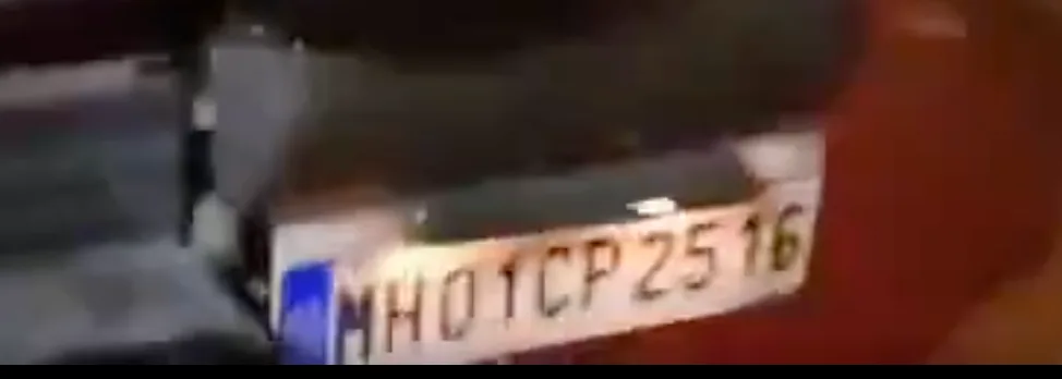 Residency Hotel board reflection and Cool Cabs taxi seen in the viral video claiming Dhruv Rathee arrest